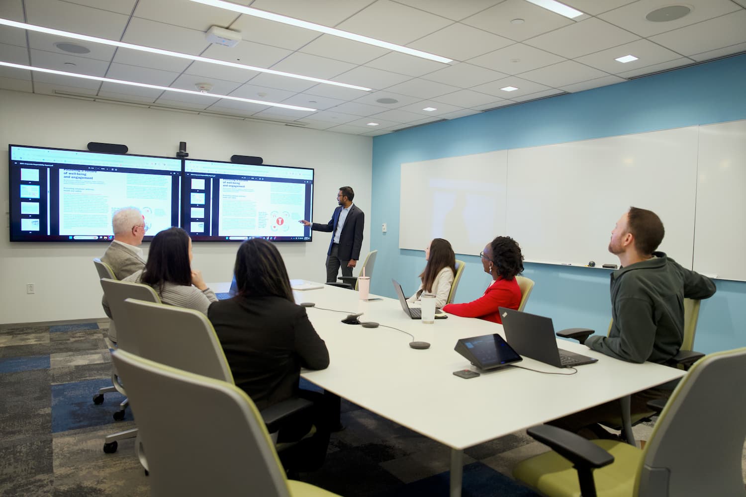 Employees in a large conference room.