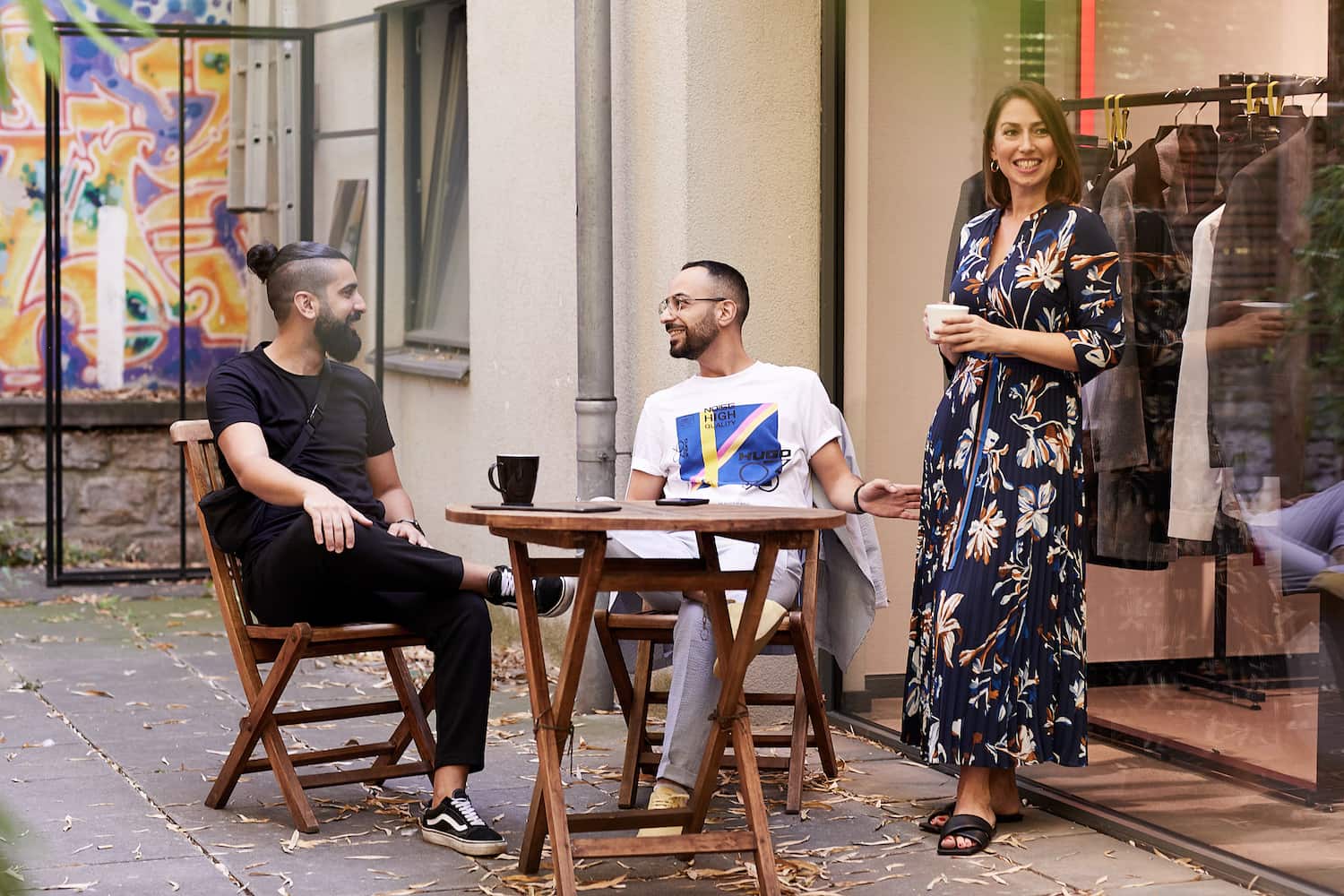 HUGO BOSS employees enjoying a coffee together. 